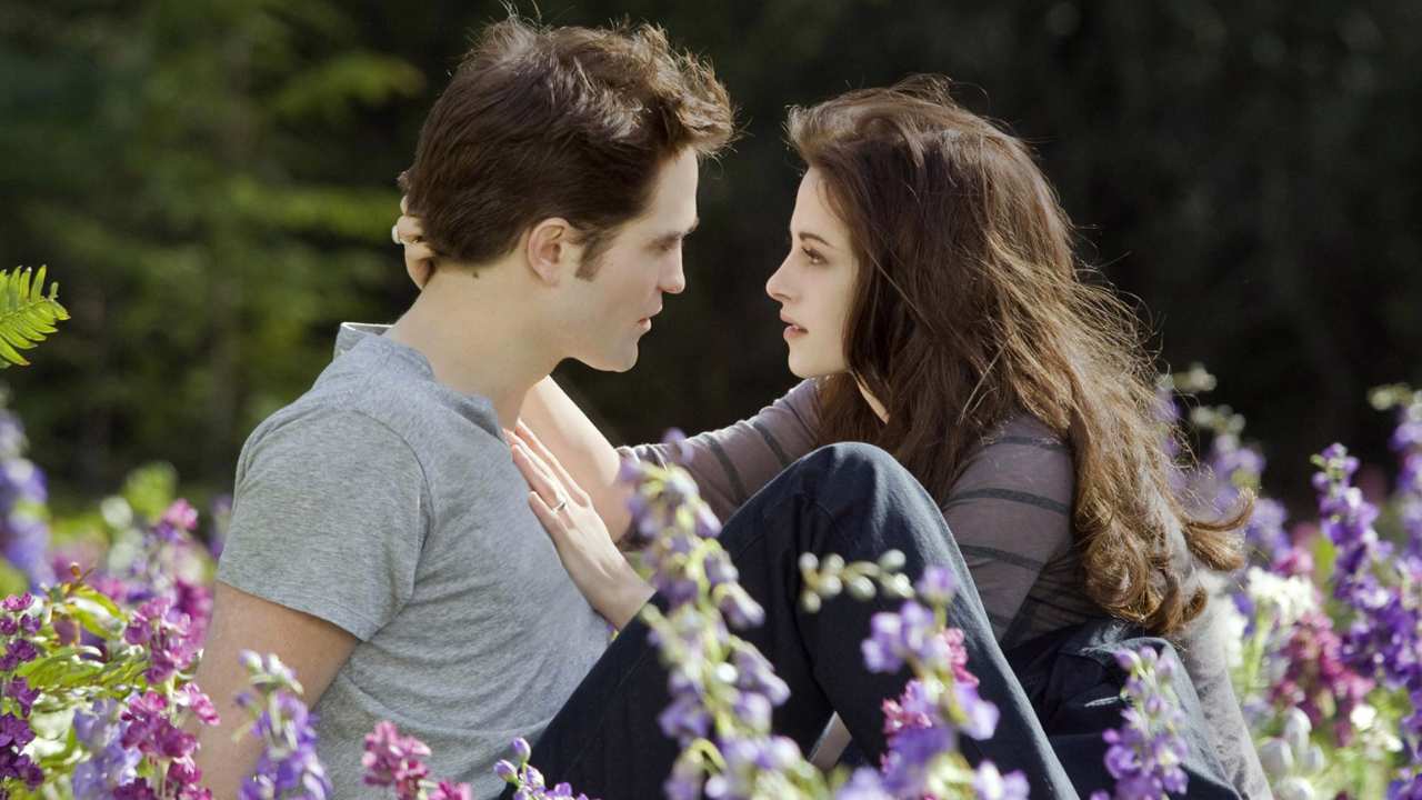 a vampire and a woman surrounded by flowers